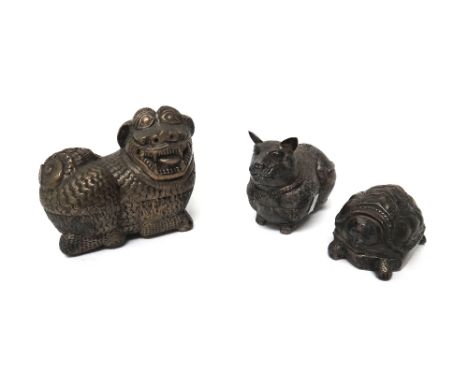 Three South East Asian white metal boxes and covers in the form of a cat, a lion dog and a turtle, the largest 13cm. diameter