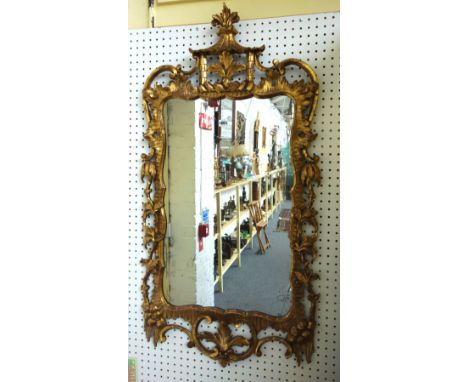 A 19th century gilt framed wall mirror, of Chinese Chippendale design, with pagoda crest and opposing 'C' scroll lower frieze