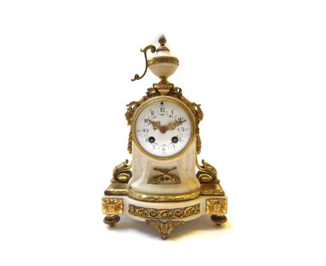 A French Empire style white marble and ormolu mounted mantel clock, late 19th century, with urn finial over a foliate decorat