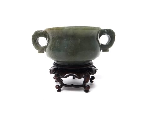 A Chinese spinach jade censer, the squat body set with animal mask handles and with a key pattern border, 14.5cm.across handl