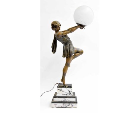 Art Deco style bronzed figural table lamp, The spherical glass shade held aloft by a dancing girl, upon a stepped marble plin