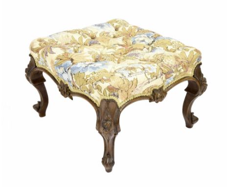 Victorian carved upholstered square footstool, the buttoned cushion upon foliate carved cabriole feet, 25" square, 17" high