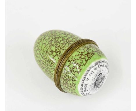 English egg shaped enamel nutmeg grater, the screw cover inscribed 'Friendship Sincere tis a jewel dear' on a mottled green g