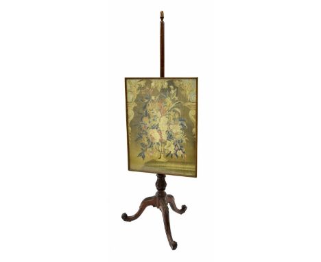 Regency mahogany adjustable pole screen, worked with a tapestry of flowers in a vase, supported upon a foliate carved tripod 