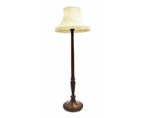 Mahogany reeded and carved standard lamp, the cluster column upon a circular base, with shade, 74" high approx overall