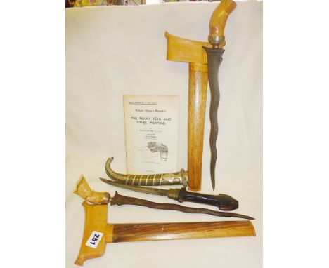 Souvenir Malay Keris knives, and a Moroccan Jambiya dagger with silvered brass scabbard and wooden hilt