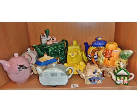 Shelf of novelty china tea pots