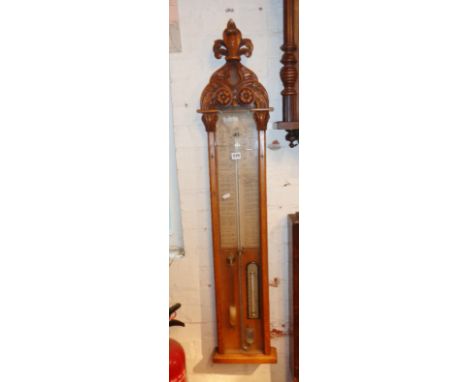 Admiral Fitzroy's Barometer with a carved pediment, brass slide indicators, original backpaper, mercury, thermometer and stor