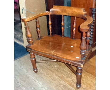 19th c. mahogany Smokers bow pub chair curved top rail on turned supports and legs with stretchers