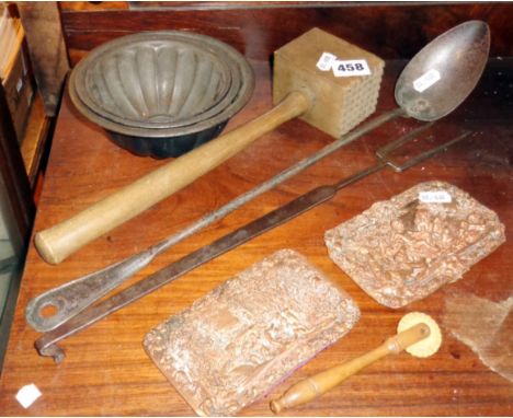 Kitchenalia - 19th c. hand forged steel toasting fork, similar ladle, three metal jelly moulds, two copper relief plaques, wo
