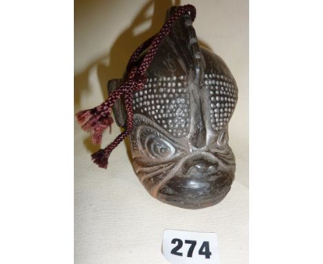 Tibetan ceramic bell in the form of a monkey's head (12cm high), incised signature to base