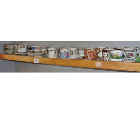 Collection of coffee cans and saucers (one shelf)