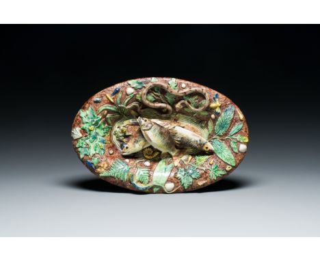 Full title: A French oval dish with applied fish in Palissy-style maiolica, Victor Barbizet (1808-1884), 19th C.Description:D