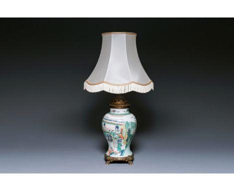 Full title: A Chinese famille verte vase mounted as a lamp, KangxiDescription:H.: 34 cm (the porcelain)H.: 92,5 cm (the lamp)