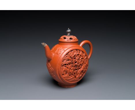 Full title: A Chinese reticulated double-walled Yixing stoneware teapot and cover with silver mounts, KangxiDescription:H.: 1