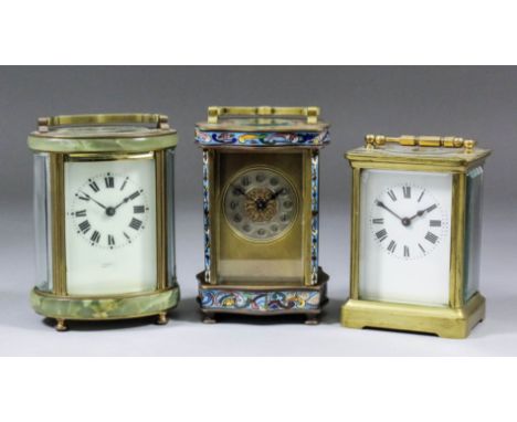 A early 20th Century French gilt brass and champleve enamel carriage timepiece, the 1.75ins diameter silvered dial with Arabi