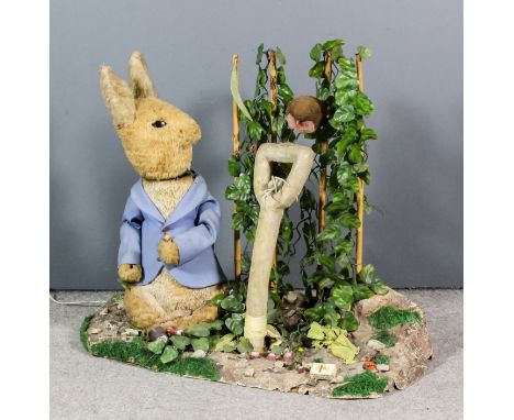A mid 20th Century automaton model of "Mr Peter Rabbit in Mr McGregor's Garden", 29.5ins high x 36ins overall