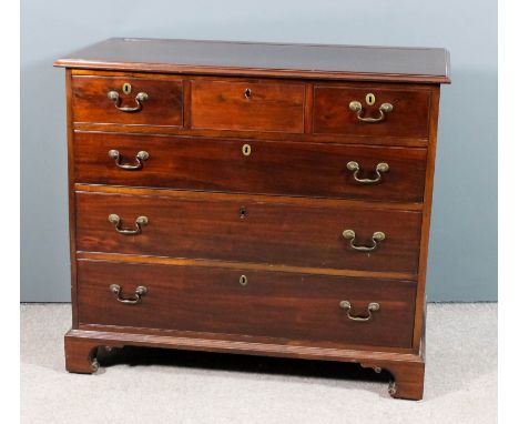 A George III mahogany chest with moulded edge to top, fitted three short and three long graduated drawers, on bracket feet, 4