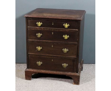 A late Georgian mahogany night commode now converted to a chest, with moulded edge to top, fitted four long graduated drawers