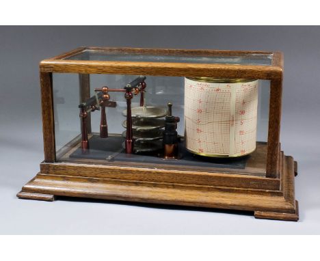 A Negretti and Zambra recording barograph in oak and glazed rectangular case, with moulded base and bracket feet, 13.75ins x 