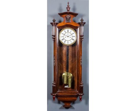 A late 19th Century Continental walnut cased "Vienna Regulator", the 7ins diameter white enamel dial with Roman numerals, to 