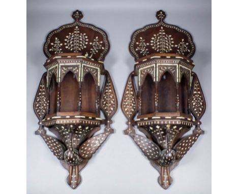 A pair of 20th Century Indian hardwood and bone wall display double shelf brackets, the lower bracket with architectural colo