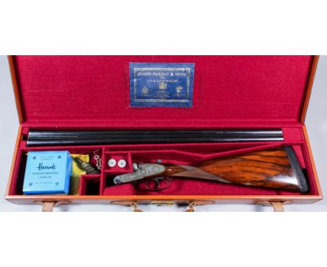 A good 12 bore side by side shotgun by James Purdey & Sons of London, Serial No. 12391, the 28ins blued steel barrels with pl