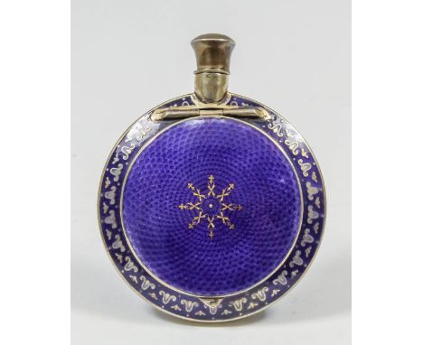 A Continental sterling silver and blue guilloche enamel circular compact/scent bottle, with flattened sides and with engine t