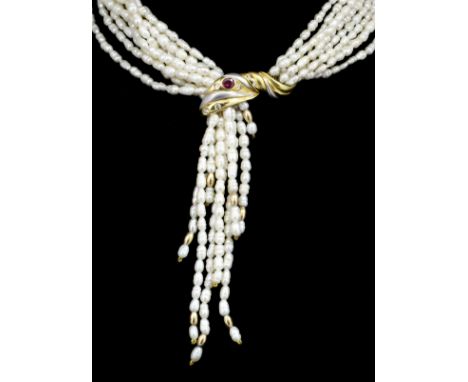 A modern nine strand freshwater pearl necklace, 810mm overall, with 18k white and yellow gold ruby and diamond set stylised l