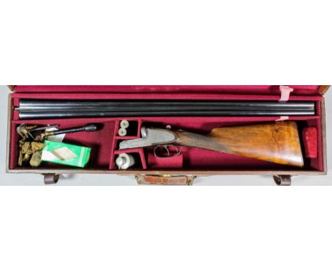 A 12 bore sidelock ejector shotgun by Cogswell & Harrison of London, Serial No. 46290, the 30ins blued steel barrels with pla