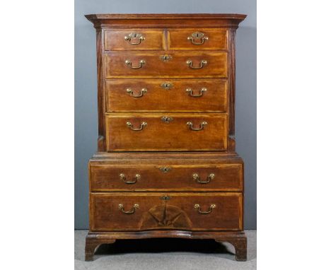 An 18th Century oak low tallboy, the drawer fronts inlaid with herringbone bandings, the upper part with deep moulded cornice