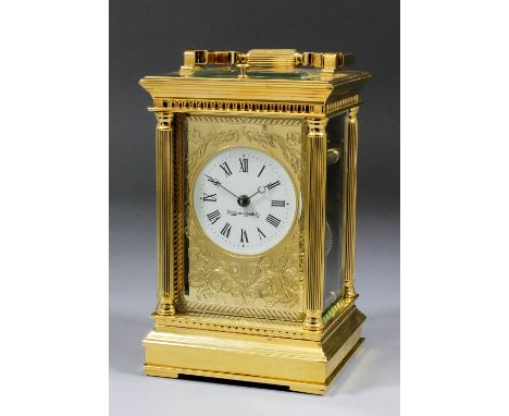 A modern Mappin & Webb carriage clock, the 2.25ins diameter white enamel dial with Roman numerals, within gilt slip engraved 