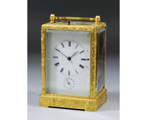 A late 19th Century French carriage clock, the white enamel dial with Roman numerals, to the eight day two train movement wit