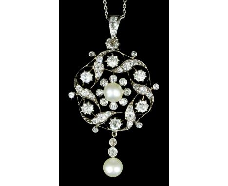 A late Victorian gold and silvery coloured metal mounted pearl and diamond flower head pattern pendant, the centre set with a