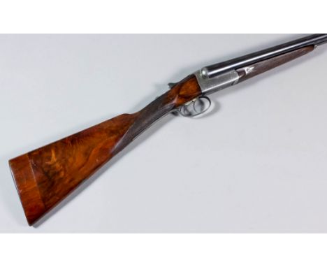 A 12 bore side by side box lock shotgun by Joseph Lang & Son of London, 28ins blued steel barrels with plain top rib, barrels