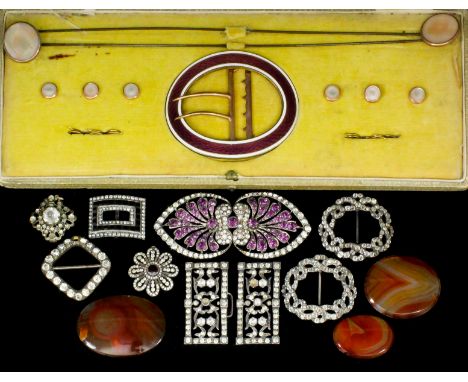 A late Victorian gilt metal and enamel oval pattern buckle, the engine turned face with purple enamel within white enamel bor