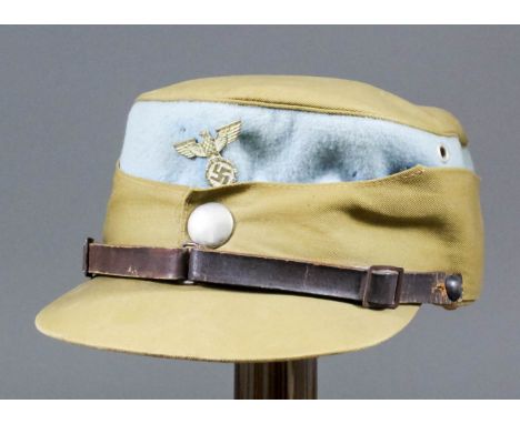 A German World War II SA coffee-can visor cap with light blue piping