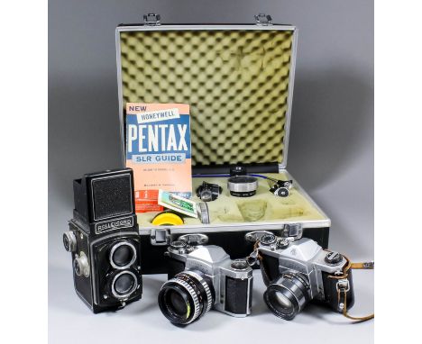 A Franke and Heidecke Rolleicord camera with 1: 3.5 lens (No.128067), with original leather case, and two Pentax SLR cameras 