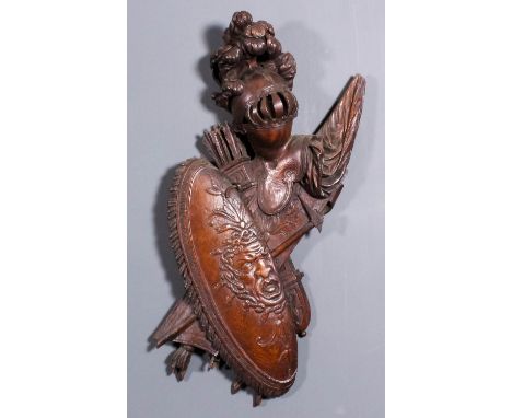 A 19th Century French oak wall applique carved with military trophies including - helm, shield with the head of Medusa, quive