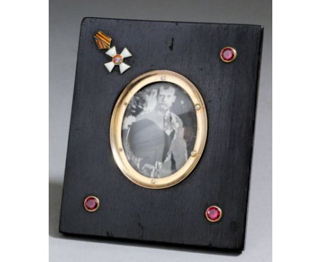 A late 19th/early 20th Century Russian gold mounted, enamel and ebonised rectangular photograph frame by Faberge, workmaster 