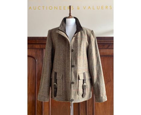 A lady's Jack Murphy of Ireland tweed field coat, in a moss green herringbone weave with blue and coral check, with brown lea