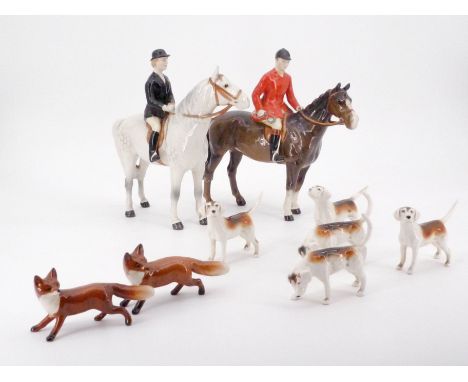 A Beswick hunting group, comprising huntsman (horse leg a/f), huntswoman, five fox hounds and two foxes