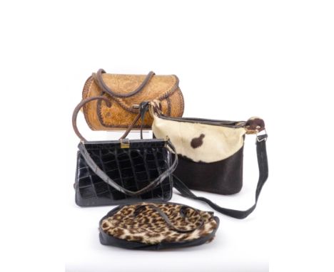 Vintage handbags including a 1960s cowhide shoulder bag, a vintage dyed coney fur handbag in the style of leopard skin, and a