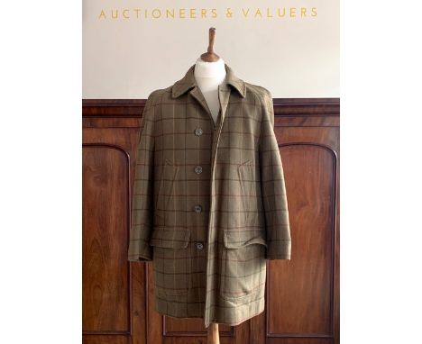 A gentleman's Invertere checked wool shooting jacket retailed by Campbell Brown of Carlisle, in green, black red and ochre ch