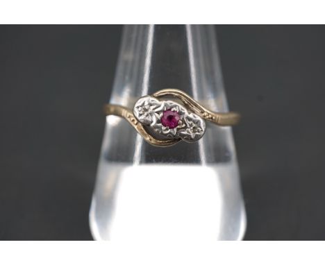 A vintage 18ct gold, diamond and ruby twist-set ring, size R, 2.6g