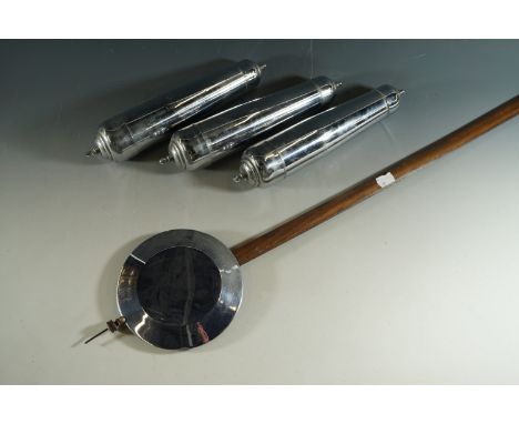 Three long case clock weights and a pendulum