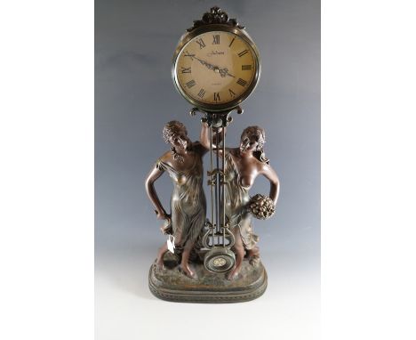 A "Juliana" reproduction figural clock, bronzed resin, late 20th Century, 78 cm