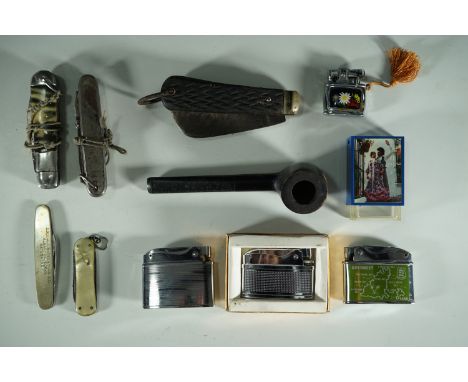 Vintage cigarette lighter and pocket knives including a Goodall's Diesel advertising knife