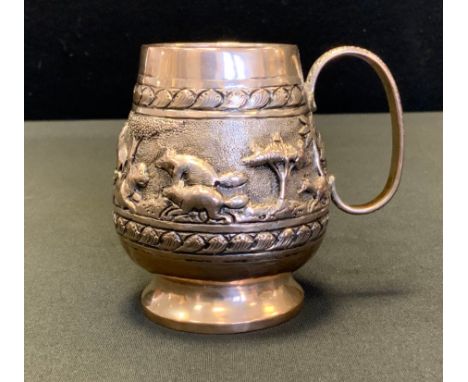 An Indian silver coloured metal cup, embossed with Lions, and other animals on the savannah, unmarked, 8cm high, 109.6g gross