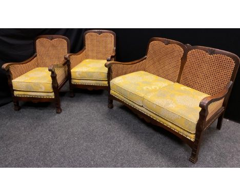 An oak, Bergere conservatory suite, comprising three seat sofa, and pair of armchairs, (3). 